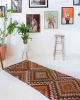 Vintage Turkish runner rug in living room setting, old rug, antique rug, pastel colors, faded colors, Turkish rug, vintage rug, soft rug, Portland, Oregon, rug store, rug shop, local shop