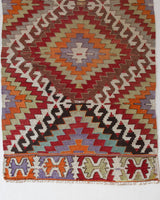 Vintage Turkish runner rug in living room setting, old rug, antique rug, pastel colors, faded colors, Turkish rug, vintage rug, soft rug, Portland, Oregon, rug store, rug shop, local shop