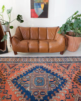Vintage Turkish rug in living room setting, old rug, antique rug, pastel colors, faded colors, Turkish rug, vintage rug, soft rug, Portland, Oregon, rug store, rug shop, local shop, pastel colors