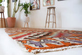 Vintage Turkish runner rug in living room setting, old rug, antique rug, pastel colors, faded colors, Turkish rug, vintage rug, soft rug, Portland, Oregon, rug store, rug shop, local shop