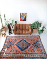 Vintage Turkish rug in living room setting, old rug, antique rug, pastel colors, faded colors, Turkish rug, vintage rug, soft rug, Portland, Oregon, rug store, rug shop, local shop, pastel colors