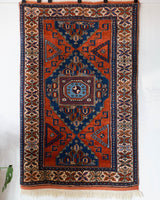 Vintage Turkish rug in a living room setting, pile rug, Turkish rug, vintage rug, portland, rug shop, bright colors, wild shaman, soft rug, bold color, Portland, Oregon, rug store, rug shop, local shop, antique rug