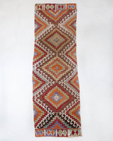 Vintage Turkish runner rug in living room setting, old rug, antique rug, pastel colors, faded colors, Turkish rug, vintage rug, soft rug, Portland, Oregon, rug store, rug shop, local shop