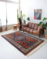 Vintage Turkish rug in a living room setting, pile rug, Turkish rug, vintage rug, portland, rug shop, bright colors, wild shaman, soft rug, bold color, Portland, Oregon, rug store, rug shop, local shop, antique rug