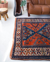 Vintage Turkish rug in a living room setting, pile rug, Turkish rug, vintage rug, portland, rug shop, bright colors, wild shaman, soft rug, bold color, Portland, Oregon, rug store, rug shop, local shop, antique rug