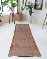 Vintage Turkish runner rug in living room setting, old rug, antique rug, pastel colors, faded colors, Turkish rug, vintage rug, soft rug, Portland, Oregon, rug store, rug shop, local shop