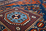 Vintage Turkish rug in a living room setting, pile rug, Turkish rug, vintage rug, portland, rug shop, bright colors, wild shaman, soft rug, bold color, Portland, Oregon, rug store, rug shop, local shop, antique rug