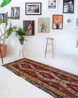 Vintage Turkish runner rug in a living room setting, pile rug, Turkish rug, vintage rug, portland, rug shop, bright colors, wild shaman, soft rug, bold color, Portland, Oregon, rug store, rug shop, local shop, antique rug