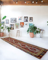 Vintage Turkish runner rug in a living room setting, pile rug, Turkish rug, vintage rug, portland, rug shop, bright colors, wild shaman, soft rug, bold color, Portland, Oregon, rug store, rug shop, local shop, antique rug