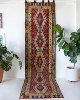 Vintage Turkish runner rug in a living room setting, pile rug, Turkish rug, vintage rug, portland, rug shop, bright colors, wild shaman, soft rug, bold color, Portland, Oregon, rug store, rug shop, local shop, antique rug