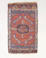 Vintage Turkish mini rug in room decor setting, old rug, antique rug, pastel colors, faded colors, Turkish rug, vintage rug, soft rug, Portland, Oregon, rug store, rug shop, local shop