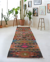 Vintage Turkish runner rug in a living room setting, pile rug, Turkish rug, vintage rug, portland, rug shop, bright colors, wild shaman, soft rug, bold color, Portland, Oregon, rug store, rug shop, local shop, antique rug