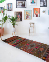 Vintage Turkish runner rug in a living room setting, pile rug, Turkish rug, vintage rug, portland, rug shop, bright colors, wild shaman, soft rug, bold color, Portland, Oregon, rug store, rug shop, local shop, antique rug