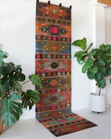 Vintage Turkish runner rug in a living room setting, pile rug, Turkish rug, vintage rug, portland, rug shop, bright colors, wild shaman, soft rug, bold color, Portland, Oregon, rug store, rug shop, local shop, antique rug