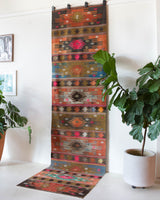 Vintage Turkish runner rug in a living room setting, pile rug, Turkish rug, vintage rug, portland, rug shop, bright colors, wild shaman, soft rug, bold color, Portland, Oregon, rug store, rug shop, local shop, antique rug