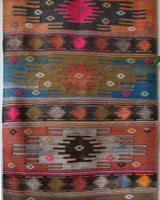 Vintage Turkish runner rug in a living room setting, pile rug, Turkish rug, vintage rug, portland, rug shop, bright colors, wild shaman, soft rug, bold color, Portland, Oregon, rug store, rug shop, local shop, antique rug