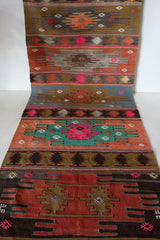 Vintage Turkish runner rug in a living room setting, pile rug, Turkish rug, vintage rug, portland, rug shop, bright colors, wild shaman, soft rug, bold color, Portland, Oregon, rug store, rug shop, local shop, antique rug