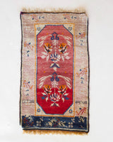 Vintage Turkish mini rug in room decor setting, old rug, antique rug, pastel colors, faded colors, Turkish rug, vintage rug, soft rug, Portland, Oregon, rug store, rug shop, local shop