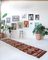 Vintage Turkish runner rug in a living room setting, pile rug, Turkish rug, vintage rug, portland, rug shop, bright colors, wild shaman, soft rug, bold color, Portland, Oregon, rug store, rug shop, local shop, antique rug