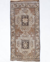 Vintage Turkish mini rug in room decor setting, old rug, antique rug, pastel colors, faded colors, Turkish rug, vintage rug, soft rug, Portland, Oregon, rug store, rug shop, local shop