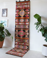 Vintage Turkish runner rug in a living room setting, pile rug, Turkish rug, vintage rug, portland, rug shop, bright colors, wild shaman, soft rug, bold color, Portland, Oregon, rug store, rug shop, local shop, antique rug