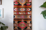 Vintage Turkish runner rug in a living room setting, pile rug, Turkish rug, vintage rug, portland, rug shop, bright colors, wild shaman, soft rug, bold color, Portland, Oregon, rug store, rug shop, local shop, antique rug