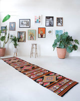 Vintage Turkish runner rug in a living room setting, pile rug, Turkish rug, vintage rug, portland, rug shop, bright colors, wild shaman, soft rug, bold color, Portland, Oregon, rug store, rug shop, local shop, antique rug