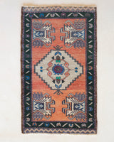 Vintage Turkish mini rug in room decor setting, old rug, antique rug, pastel colors, faded colors, Turkish rug, vintage rug, soft rug, Portland, Oregon, rug store, rug shop, local shop