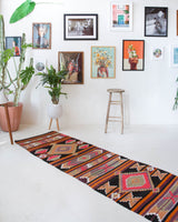 Vintage Turkish runner rug in a living room setting, pile rug, Turkish rug, vintage rug, portland, rug shop, bright colors, wild shaman, soft rug, bold color, Portland, Oregon, rug store, rug shop, local shop, antique rug