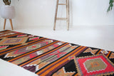 Vintage Turkish runner rug in a living room setting, pile rug, Turkish rug, vintage rug, portland, rug shop, bright colors, wild shaman, soft rug, bold color, Portland, Oregon, rug store, rug shop, local shop, antique rug