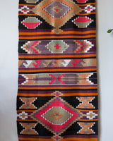 Vintage Turkish runner rug in a living room setting, pile rug, Turkish rug, vintage rug, portland, rug shop, bright colors, wild shaman, soft rug, bold color, Portland, Oregon, rug store, rug shop, local shop, antique rug