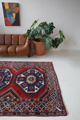 Vintage Turkish rug in a living room setting, pile rug, Turkish rug, vintage rug, portland, rug shop, bright colors, wild shaman, soft rug, bold color, Portland, Oregon, rug store, rug shop, local shop, antique rug