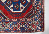 Vintage Turkish rug in a living room setting, pile rug, Turkish rug, vintage rug, portland, rug shop, bright colors, wild shaman, soft rug, bold color, Portland, Oregon, rug store, rug shop, local shop, antique rug