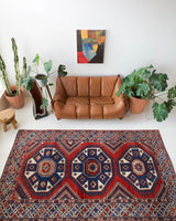 Vintage Turkish rug in a living room setting, pile rug, Turkish rug, vintage rug, portland, rug shop, bright colors, wild shaman, soft rug, bold color, Portland, Oregon, rug store, rug shop, local shop, antique rug