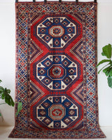 Vintage Turkish rug in a living room setting, pile rug, Turkish rug, vintage rug, portland, rug shop, bright colors, wild shaman, soft rug, bold color, Portland, Oregon, rug store, rug shop, local shop, antique rug