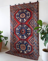 Vintage Turkish rug in a living room setting, pile rug, Turkish rug, vintage rug, portland, rug shop, bright colors, wild shaman, soft rug, bold color, Portland, Oregon, rug store, rug shop, local shop, antique rug