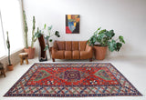 Vintage Turkish rug in a living room setting, pile rug, Turkish rug, vintage rug, portland, rug shop, bright colors, wild shaman, soft rug, bold color, Portland, Oregon, rug store, rug shop, local shop, antique rug