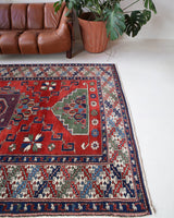 Vintage Turkish rug in a living room setting, pile rug, Turkish rug, vintage rug, portland, rug shop, bright colors, wild shaman, soft rug, bold color, Portland, Oregon, rug store, rug shop, local shop, antique rug