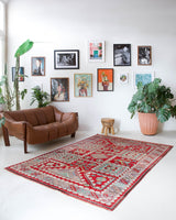 Vintage Turkish rug in a living room setting, pile rug, Turkish rug, vintage rug, portland, rug shop, bright colors, wild shaman, soft rug, bold color, Portland, Oregon, rug store, rug shop, local shop