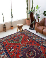 Vintage Turkish rug in a living room setting, pile rug, Turkish rug, vintage rug, portland, rug shop, bright colors, wild shaman, soft rug, bold color, Portland, Oregon, rug store, rug shop, local shop, antique rug
