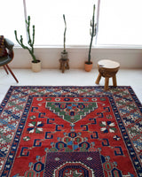 Vintage Turkish rug in a living room setting, pile rug, Turkish rug, vintage rug, portland, rug shop, bright colors, wild shaman, soft rug, bold color, Portland, Oregon, rug store, rug shop, local shop, antique rug
