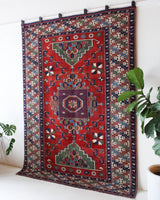 Vintage Turkish rug in a living room setting, pile rug, Turkish rug, vintage rug, portland, rug shop, bright colors, wild shaman, soft rug, bold color, Portland, Oregon, rug store, rug shop, local shop, antique rug
