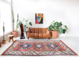 Vintage Turkish rug in living room setting, old rug, antique rug, pastel colors, faded colors, Turkish rug, vintage rug, soft rug, Portland, Oregon, rug store, rug shop, local shop