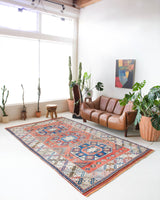 Vintage Turkish rug in living room setting, old rug, antique rug, pastel colors, faded colors, Turkish rug, vintage rug, soft rug, Portland, Oregon, rug store, rug shop, local shop