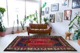 Vintage Turkish rug in a living room setting, pile rug, Turkish rug, vintage rug, portland, rug shop, bright colors, wild shaman, soft rug, bold color, Portland, Oregon, rug store, rug shop, local shop