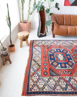 Vintage Turkish rug in living room setting, old rug, antique rug, pastel colors, faded colors, Turkish rug, vintage rug, soft rug, Portland, Oregon, rug store, rug shop, local shop