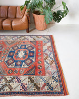 Vintage Turkish rug in living room setting, old rug, antique rug, pastel colors, faded colors, Turkish rug, vintage rug, soft rug, Portland, Oregon, rug store, rug shop, local shop