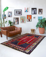 Vintage Turkish rug in a living room setting, pile rug, Turkish rug, vintage rug, portland, rug shop, bright colors, wild shaman, soft rug, bold color, Portland, Oregon, rug store, rug shop, local shop