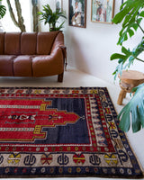 Vintage Turkish rug in a living room setting, pile rug, Turkish rug, vintage rug, portland, rug shop, bright colors, wild shaman, soft rug, bold color, Portland, Oregon, rug store, rug shop, local shop