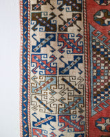 Vintage Turkish rug in living room setting, old rug, antique rug, pastel colors, faded colors, Turkish rug, vintage rug, soft rug, Portland, Oregon, rug store, rug shop, local shop